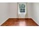 Bedroom features wood flooring and natural light from the window at 856 Glenway Dr, East Point, GA 30344
