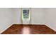 Bright bedroom with a large window and hardwood floors at 856 Glenway Dr, East Point, GA 30344