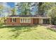 Charming brick home with a well-maintained lawn and attached carport at 856 Glenway Dr, East Point, GA 30344