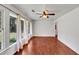 Bright living room with hardwood floors, ample windows and ceiling fan at 856 Glenway Dr, East Point, GA 30344