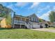 Charming two-story home with a covered front porch and a well-manicured lawn at 1035 Avalon Dr, Lawrenceville, GA 30044