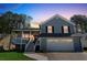 Charming two-story home with a covered front porch and attached two-car garage at 1035 Avalon Dr, Lawrenceville, GA 30044
