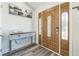 Elegant foyer featuring hardwood floors, a stylish console table, and a decorative front door at 1035 Avalon Dr, Lawrenceville, GA 30044