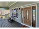 Inviting front porch with seating area and a beautifully crafted front door with sidelights at 1035 Avalon Dr, Lawrenceville, GA 30044