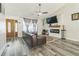 Bright living room with a fireplace, hardwood floors, and stylish decor at 1035 Avalon Dr, Lawrenceville, GA 30044