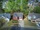 Aerial view of beautiful two-story home with mature trees and landscaping at 4111 Mcever Woods Nw Dr, Acworth, GA 30101