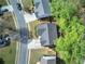 Overhead view showing rooftops and lawns interspersed with trees, creating a verdant, neighborhood scene at 4111 Mcever Woods Nw Dr, Acworth, GA 30101