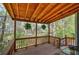 Cozy porch with wood ceiling and rails overlooking the backyard at 4111 Mcever Woods Nw Dr, Acworth, GA 30101