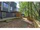 Backyard patio with wood pergola, privacy screen, and fenced lawn area at 4111 Mcever Woods Nw Dr, Acworth, GA 30101