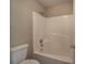 Bathroom features a white tiled shower and toilet at 4111 Mcever Woods Nw Dr, Acworth, GA 30101