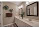 Bathroom featuring double sinks, a mirror, and plants at 4111 Mcever Woods Nw Dr, Acworth, GA 30101