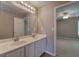 Bathroom featuring double sinks and a large mirror at 4111 Mcever Woods Nw Dr, Acworth, GA 30101