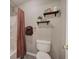 Cozy bathroom featuring open shelving, a shower with curtain, and neutral paint at 4111 Mcever Woods Nw Dr, Acworth, GA 30101