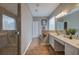 The main bathroom features double vanity, glass shower and tile floors at 4111 Mcever Woods Nw Dr, Acworth, GA 30101