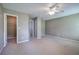 Spacious carpeted bedroom with walk-in closet and neutral paint at 4111 Mcever Woods Nw Dr, Acworth, GA 30101