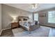 The main bedroom features natural light, ceiling fan and neutral decor at 4111 Mcever Woods Nw Dr, Acworth, GA 30101