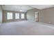 Spacious bedroom featuring large windows, neutral paint, and plush carpeting at 4111 Mcever Woods Nw Dr, Acworth, GA 30101