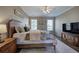 The main bedroom offers natural light, ceiling fan, and neutral decor at 4111 Mcever Woods Nw Dr, Acworth, GA 30101