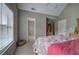 Bedroom with neutral walls and carpet, a ceiling fan, a window, and storage at 4111 Mcever Woods Nw Dr, Acworth, GA 30101