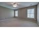 Bright bedroom featuring large windows, neutral paint, and carpet at 4111 Mcever Woods Nw Dr, Acworth, GA 30101
