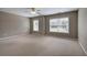 Bright bedroom featuring large windows, neutral paint, and plush carpeting at 4111 Mcever Woods Nw Dr, Acworth, GA 30101