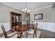 Formal dining room showcases wood floors, a china cabinet, and a view into adjacent spaces at 4111 Mcever Woods Nw Dr, Acworth, GA 30101