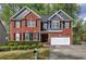 Charming two-story brick home with well-manicured landscaping at 4111 Mcever Woods Nw Dr, Acworth, GA 30101