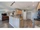 Open kitchen features granite countertops, stainless steel appliances, and wood floors with eat-in breakfast bar at 4111 Mcever Woods Nw Dr, Acworth, GA 30101