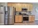 Kitchen boasts stainless steel appliances, ample cabinet space, and stunning granite countertops at 4111 Mcever Woods Nw Dr, Acworth, GA 30101