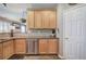 Kitchen features granite countertops, stainless steel dishwasher and light wood cabinets at 4111 Mcever Woods Nw Dr, Acworth, GA 30101