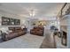 Spacious living room open to dining with fireplace, hardwood floors, and natural light at 4111 Mcever Woods Nw Dr, Acworth, GA 30101