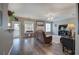 Comfortable living room featuring hardwood floors, a ceiling fan, and a door to the outside at 4111 Mcever Woods Nw Dr, Acworth, GA 30101