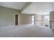 Spacious loft area featuring plush carpeting and views from the railing and windows at 4111 Mcever Woods Nw Dr, Acworth, GA 30101