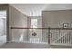 Loft railing with a chandelier and views of a window at 4111 Mcever Woods Nw Dr, Acworth, GA 30101