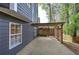 Covered outdoor patio area with brick pavers, adjacent to the home's siding and a fenced yard at 4111 Mcever Woods Nw Dr, Acworth, GA 30101