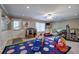 Bright playroom with colorful rug, plenty of toys, and natural light for a fun and engaging space at 4111 Mcever Woods Nw Dr, Acworth, GA 30101