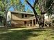 View of the back of the house, showcasing the deck and spacious yard at 4152 Scenic Mountain Dr, Snellville, GA 30039