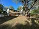 View of the backyard with deck and mature trees at 4152 Scenic Mountain Dr, Snellville, GA 30039
