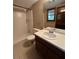 Bathroom features a walk-in shower, neutral tile and patterned walls at 4152 Scenic Mountain Dr, Snellville, GA 30039