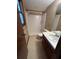 Bathroom features a walk-in shower, neutral tile and patterned walls at 4152 Scenic Mountain Dr, Snellville, GA 30039