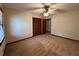 A basic carpeted bedroom featuring neutral walls, a ceiling fan, and a window for natural light at 4152 Scenic Mountain Dr, Snellville, GA 30039