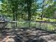 View of wood deck overlooking wooded area at 4152 Scenic Mountain Dr, Snellville, GA 30039