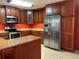 Kitchen features stainless steel appliances, granite countertops, and wood cabinets at 4152 Scenic Mountain Dr, Snellville, GA 30039
