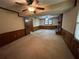 Living room features a fireplace, paneled walls, and a ceiling fan at 4152 Scenic Mountain Dr, Snellville, GA 30039