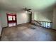 Bright living room with a ceiling fan and view into another room with hardwood floors at 4152 Scenic Mountain Dr, Snellville, GA 30039