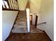 Carpeted staircase leading to the basement with wood floors at 4152 Scenic Mountain Dr, Snellville, GA 30039