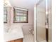 Bathroom features a stand up shower, large mirror and window providing natural light at 1152 Old Coach Rd, Stone Mountain, GA 30083