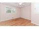 Bedroom featuring hardwood floors, wallpaper, ceiling fan and natural light at 1152 Old Coach Rd, Stone Mountain, GA 30083