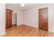 Bedroom with hardwood floors, wallpaper, ceiling fan and a closet at 1152 Old Coach Rd, Stone Mountain, GA 30083