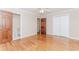 Bedroom with a ceiling fan, hardwood floors, and access to a bathroom at 1152 Old Coach Rd, Stone Mountain, GA 30083